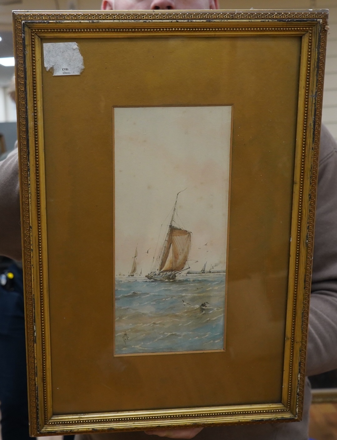 Richmond Markes, watercolour, Fishing boats off the coast, initialled, 27 x 12cm. Condition - poor to fair